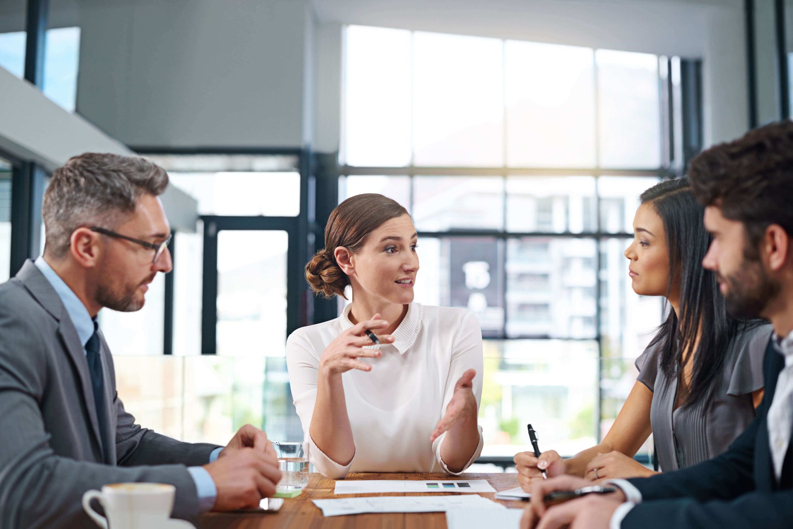 Four people in a meeting