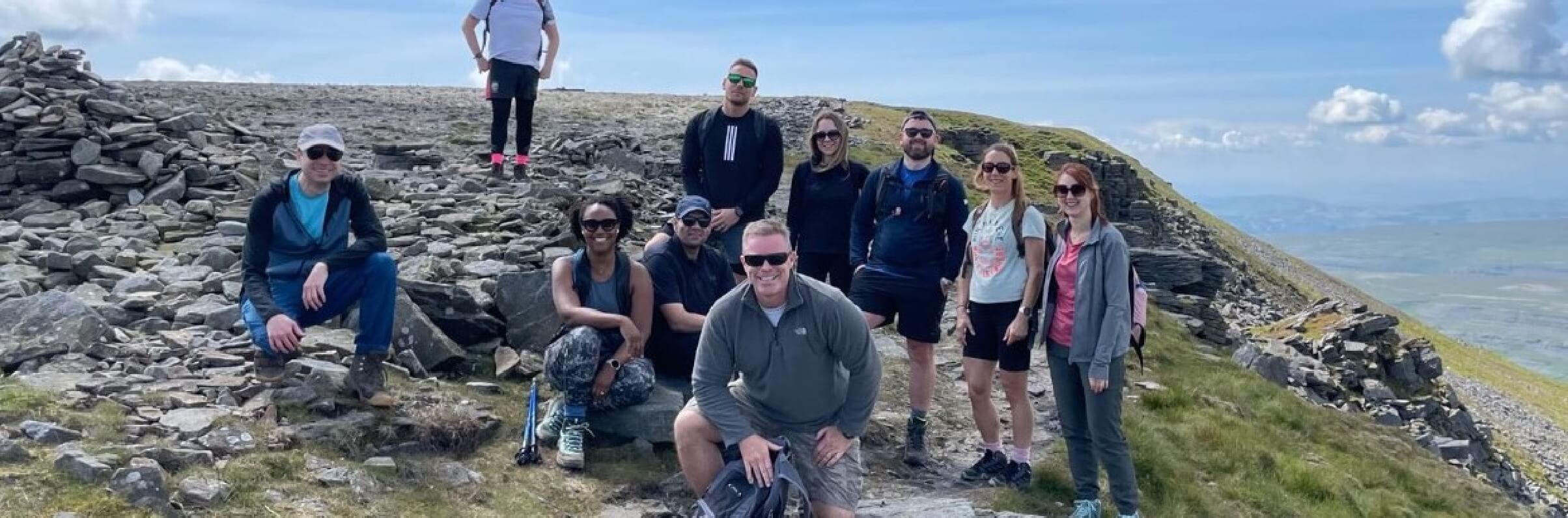 Cornerstone team posing for a picture on a mountain